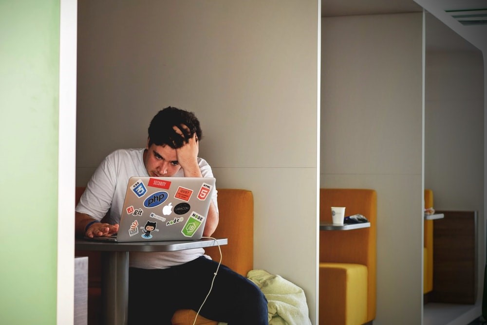 Focused man working alone on laptop